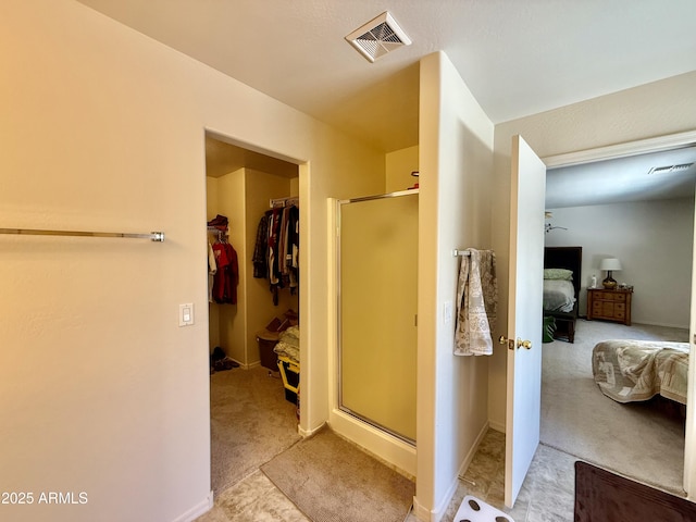 1758 E San Xavier Dr, Casa Grande, AZ 85122 - bathroom with ensuite bathroom, a shower stall, and a walk in closet
