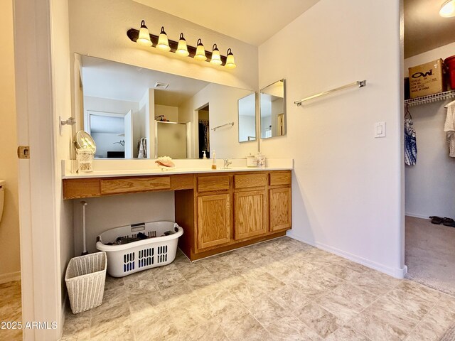 1758 E San Xavier Dr, Casa Grande, AZ 85122 - full bathroom featuring vanity, a spacious closet, and baseboards