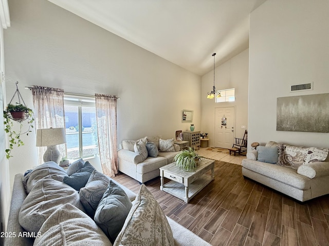 1758 E San Xavier Dr, Casa Grande, AZ 85122 - living area with high vaulted ceiling, a chandelier, and wood finished floors