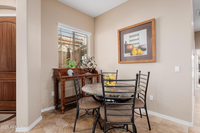 dining space with light tile patterned flooring