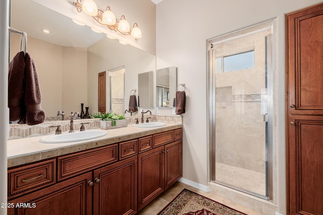 bathroom with tile patterned flooring, vanity, and an enclosed shower