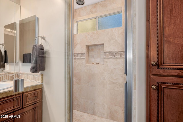 bathroom with vanity and an enclosed shower