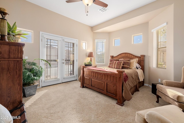 carpeted bedroom with french doors, ceiling fan, and access to outside