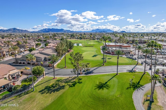 birds eye view of property with a mountain view