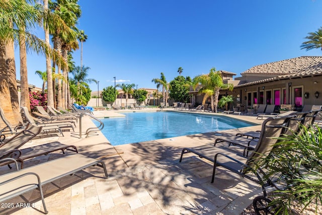 view of swimming pool featuring a patio