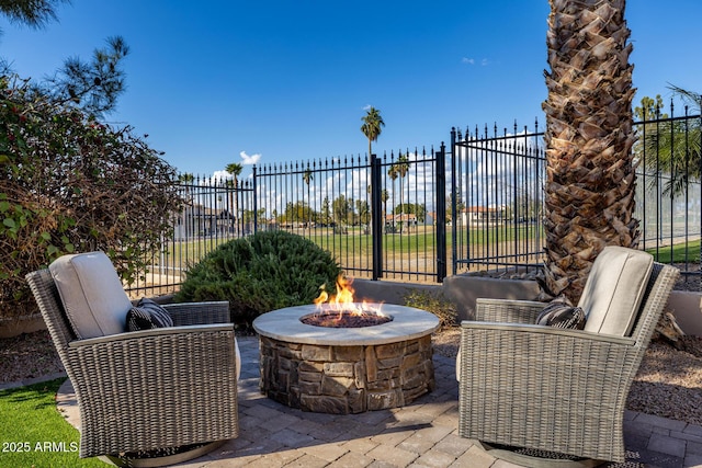 view of patio / terrace featuring an outdoor fire pit