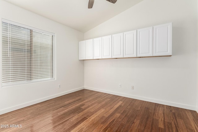 unfurnished room featuring wood-type flooring, lofted ceiling, and ceiling fan