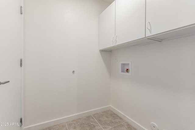 laundry area with cabinets, light tile patterned flooring, washer hookup, and hookup for a gas dryer