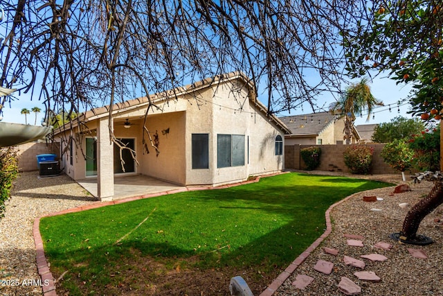 back of house featuring a yard and a patio area