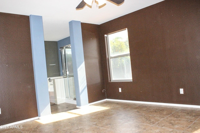 unfurnished room with ceiling fan
