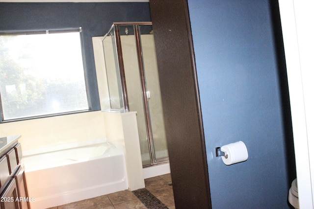 full bathroom with vanity, tile patterned floors, plus walk in shower, and toilet
