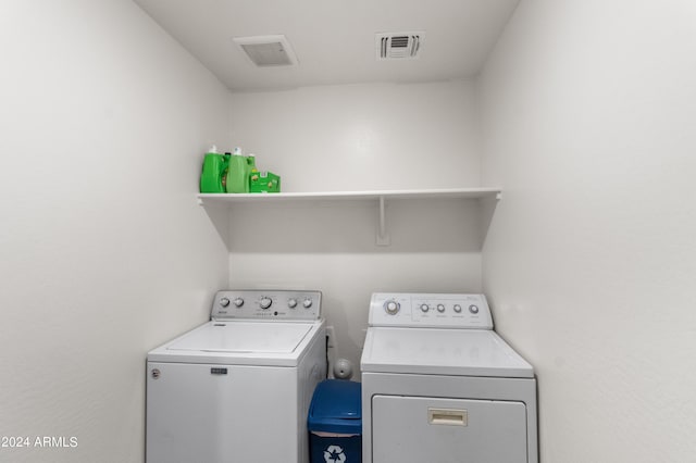 laundry area with washing machine and clothes dryer