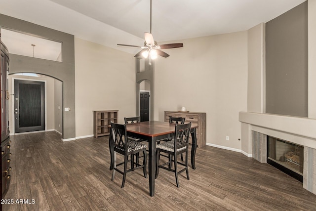 3946 N 112th Ave, Avondale, AZ 85392 - dining room with arched walkways, wood finished floors, baseboards, and a ceiling fan