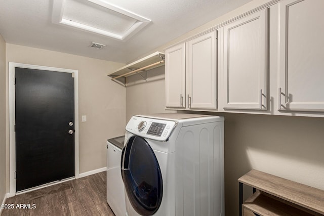 3946 N 112th Ave, Avondale, AZ 85392 - laundry area with washer / clothes dryer, dark wood-style flooring, cabinet space, attic access, and baseboards
