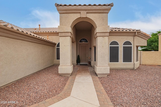 3946 N 112th Ave, Avondale, AZ 85392 - view of exterior entry featuring a tile roof and stucco siding