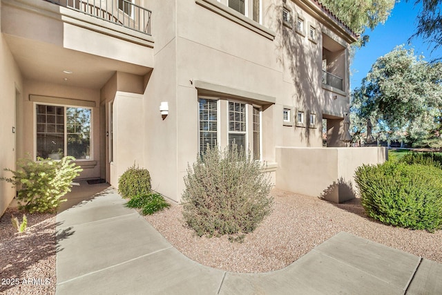 property entrance with a balcony