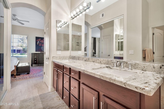 bathroom featuring vanity, ceiling fan, and hardwood / wood-style floors