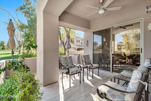 view of patio / terrace featuring ceiling fan