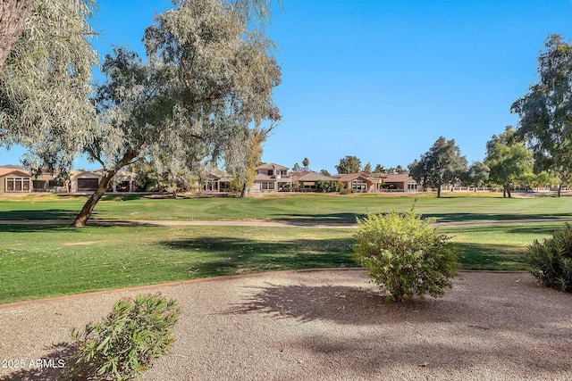 view of home's community featuring a lawn