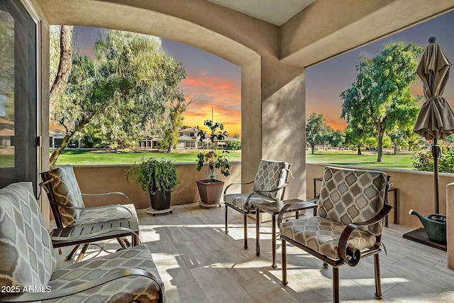 view of patio terrace at dusk