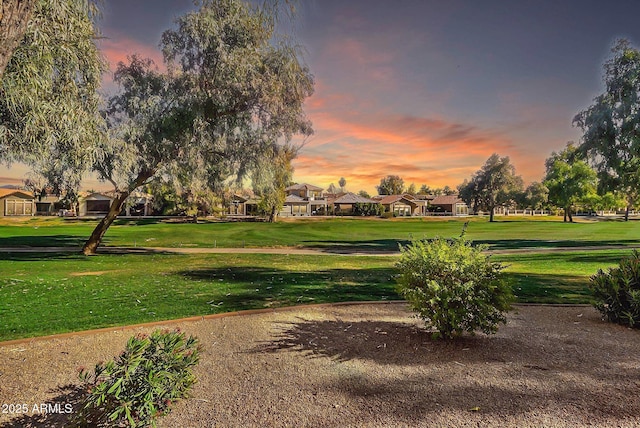 view of property's community with a lawn