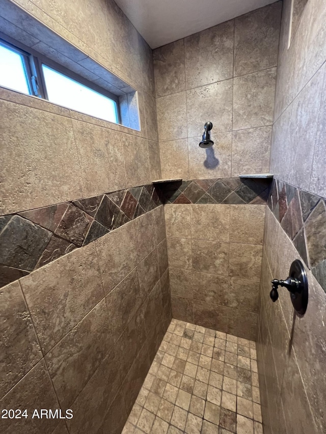 bathroom featuring a tile shower