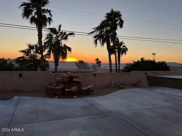 view of patio terrace at dusk