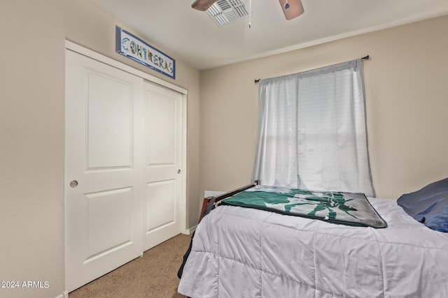 3929 S 79th Ln, Phoenix, AZ 85043 - carpeted bedroom featuring visible vents, a closet, and a ceiling fan