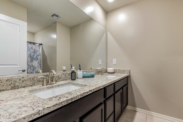 3929 S 79th Ln, Phoenix, AZ 85043 - bathroom with tile patterned flooring, double vanity, visible vents, and a sink