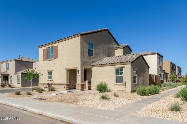 3929 S 79th Ln, Phoenix, AZ 85043 - view of front of house with a residential view, stucco siding, and a tiled roof