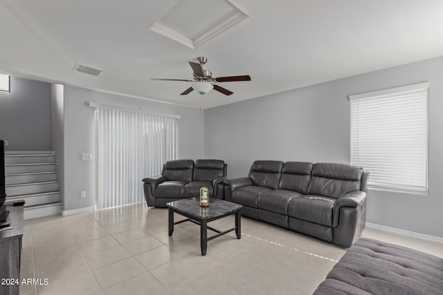 3929 S 79th Ln, Phoenix, AZ 85043 - living room with light tile patterned floors, baseboards, visible vents, and stairs