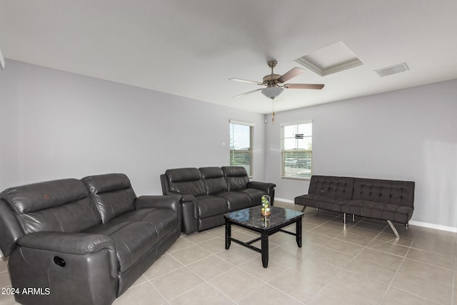 3929 S 79th Ln, Phoenix, AZ 85043 - living room featuring light tile patterned flooring, ceiling fan, baseboards, and visible vents