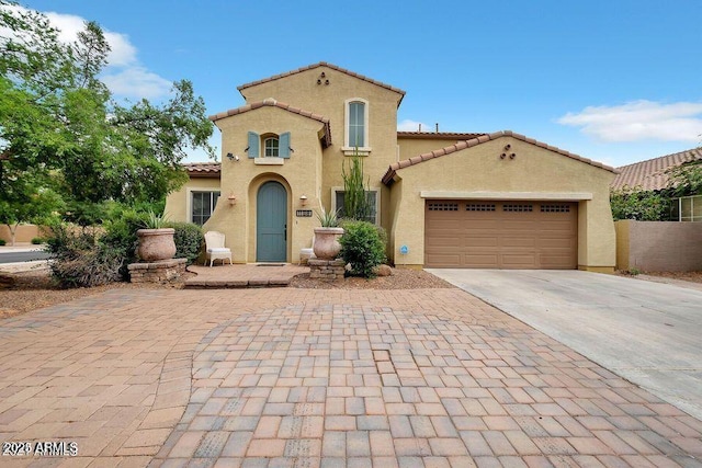 mediterranean / spanish-style home featuring a garage