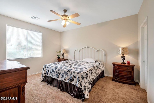 carpeted bedroom with ceiling fan