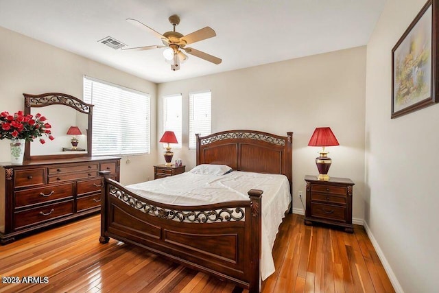 bedroom with hardwood / wood-style flooring and ceiling fan