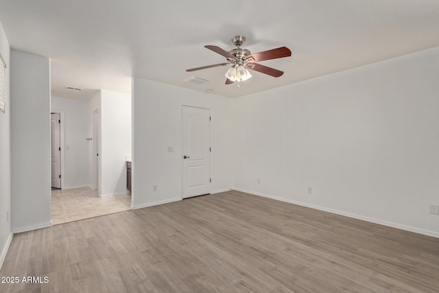 unfurnished room featuring ceiling fan and light hardwood / wood-style floors