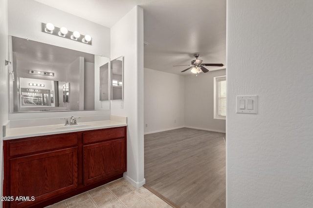 bathroom featuring vanity and ceiling fan