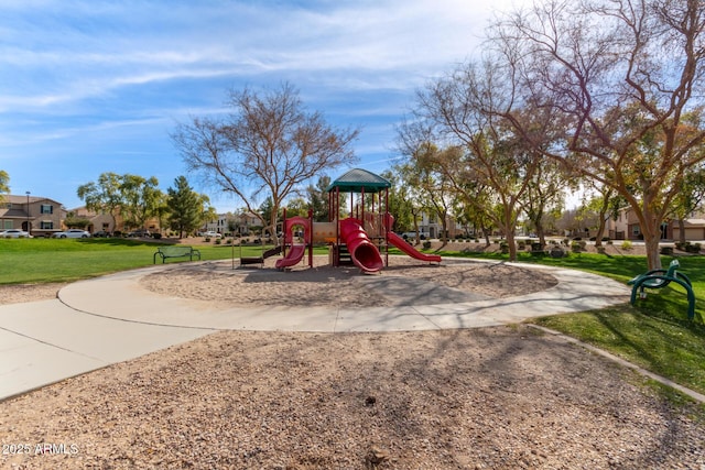 view of playground with a lawn