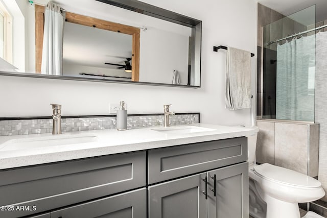 bathroom with walk in shower, toilet, tasteful backsplash, vanity, and ceiling fan