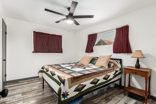 bedroom featuring ceiling fan and wood-type flooring