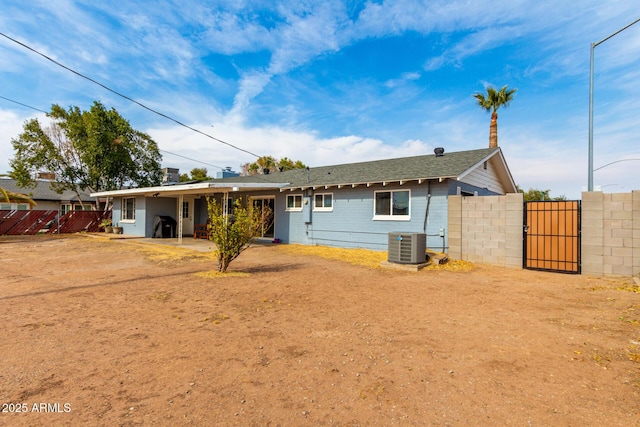 back of property featuring central air condition unit