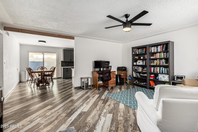 office with hardwood / wood-style flooring, ceiling fan, and a textured ceiling