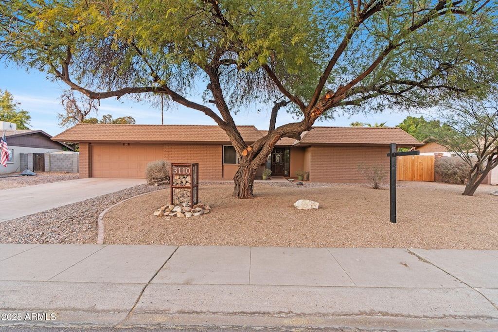 single story home with a garage