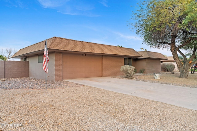 single story home featuring a garage