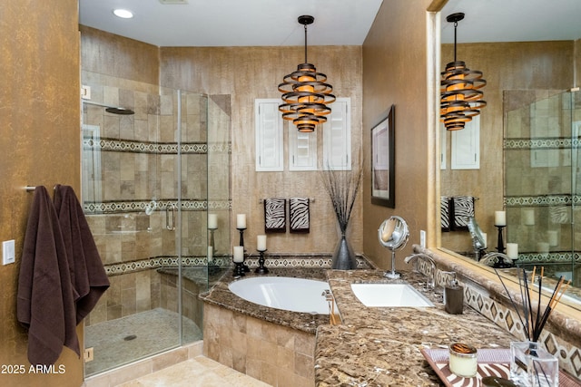 full bath with a stall shower, vanity, and a bath