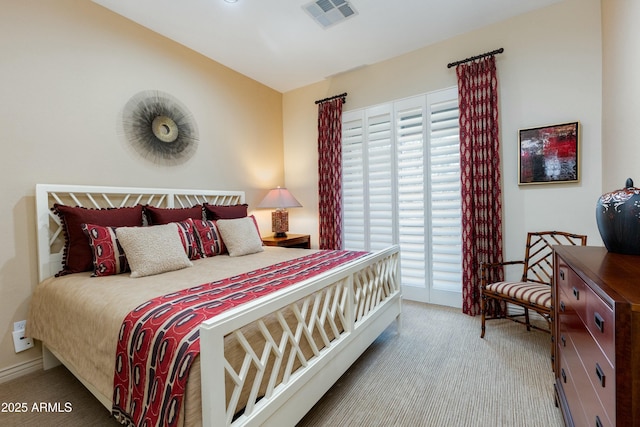 bedroom with light carpet, access to outside, and visible vents