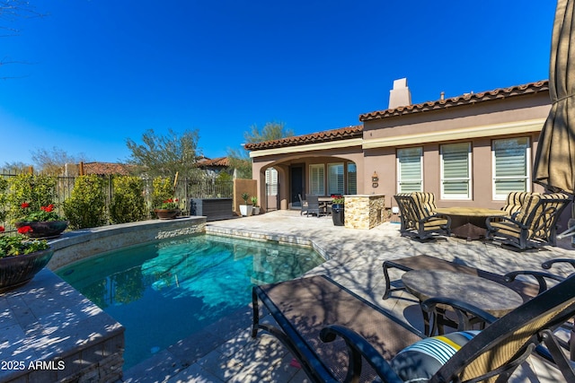 view of pool featuring a fenced in pool, an outdoor fire pit, fence, and a patio