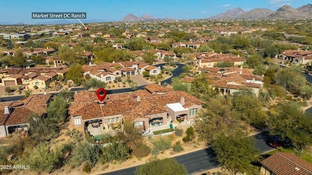 drone / aerial view with a residential view and a mountain view