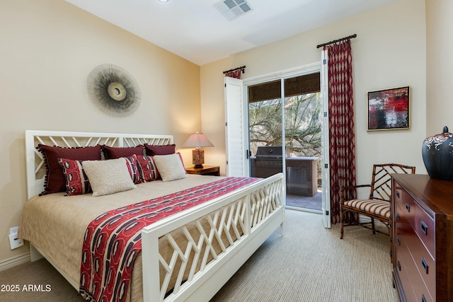 carpeted bedroom featuring access to exterior, visible vents, and baseboards