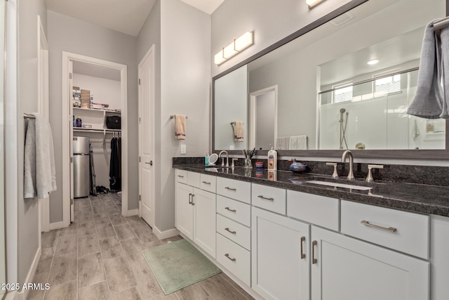 bathroom with vanity and walk in shower